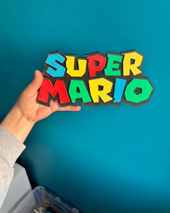 Plaque Super Mario imprimée en 3D, design couleurs vives, 24 cm.

