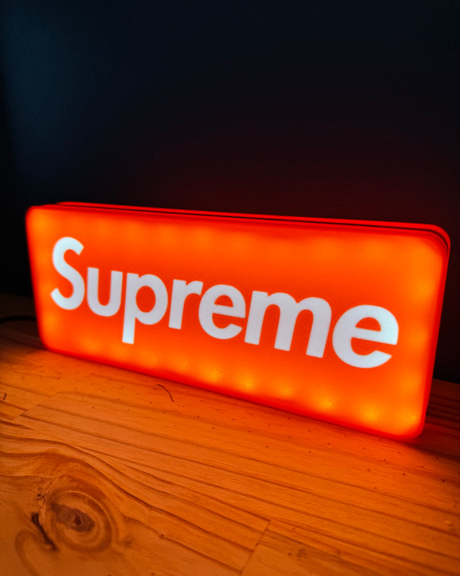 Lampe rouge avec texte blanc Supreme
