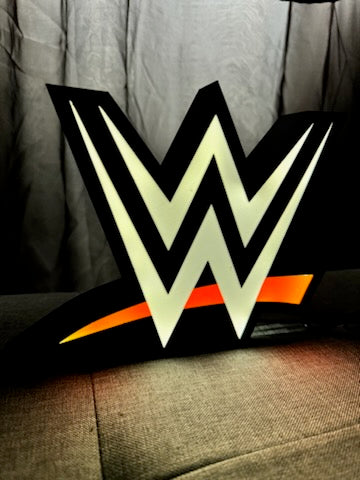 Logo WWE rouge et blanc en lumière
