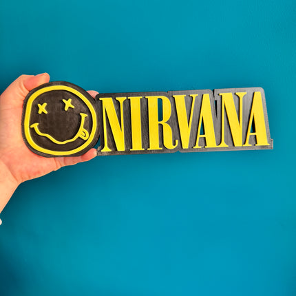 Plaque murale Nirvana en 3D, noir et jaune, format 24 cm.

